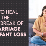 Banner with the title of the blog post, "How to Heal After the Heartbreak of Miscarriage or Infant Loss," next to a photo of Lindsey Huttner (a maternal mental health therapist and a licensed clinical social worker) sitting and meditating while holding her belly and clutching her heart.